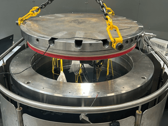 Figure 2 – Equipment being lowered into pressure test tank.